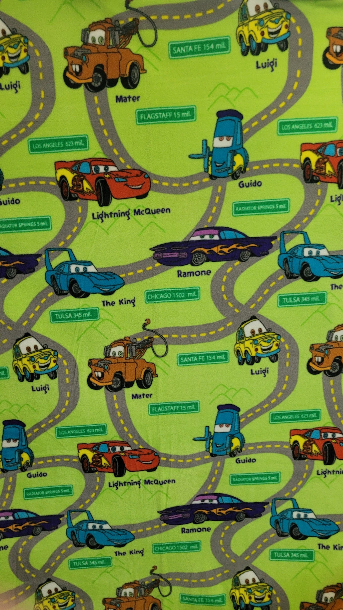 Cars Fleece on Green sold by the Half Yard