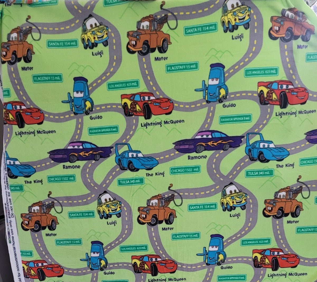 Cars Fleece on Green sold by the Half Yard