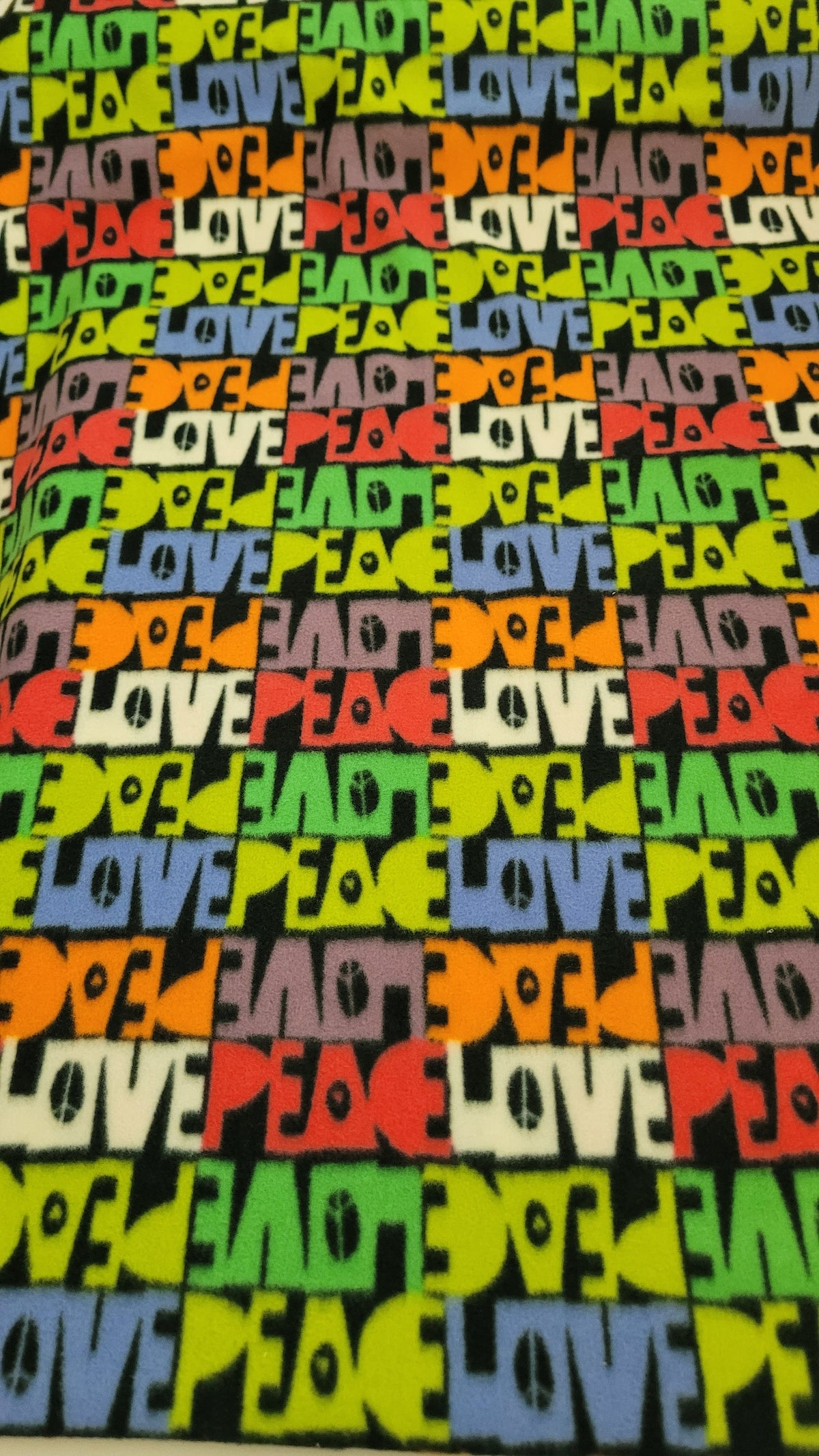 Peace and Love Fleece sold by the Half Yard