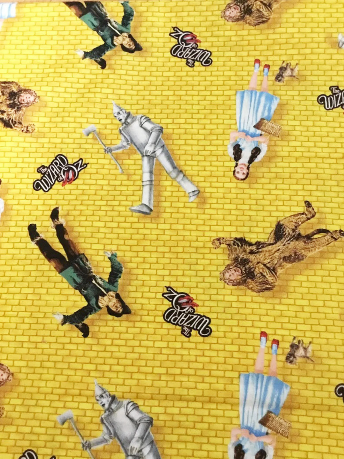 Wizard of Oz Characters Tossed on Yellow Brick Road Quilting Treasures Half Yard